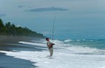 Ron Arra hooks a fish of a Costa Rican beach